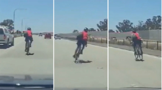 A cyclist was seen riding recklessly on a crowded motorway in Adelaide.