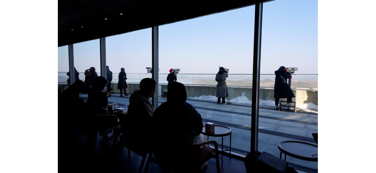 Starbucks has opened a café with a view of a heavily guarded border.