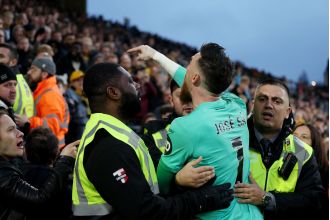 Wolves' goalie Jose Sa intervenes with irate supporter in loss to Bournemouth.