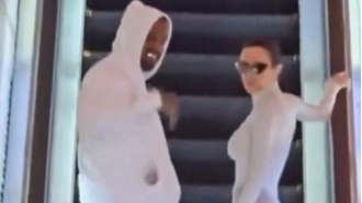 Kanye West shows off his expensive titanium teeth and avoids legal troubles in Tokyo.