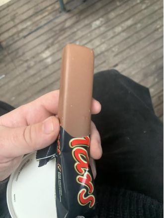 UK man awarded money after opening 'ugly' Mars bar packaging.