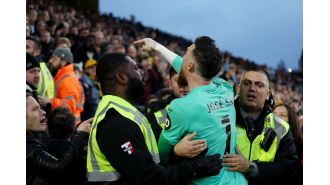 Wolves' goalie Jose Sa intervenes with irate supporter in loss to Bournemouth.