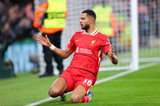 Confirmed starting lineups and predicted team formations for the highly anticipated match between Liverpool and Manchester City, along with any reported injuries.