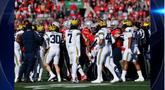 Michigan's shocking win over Ohio State leads to a chaotic fight between fans.