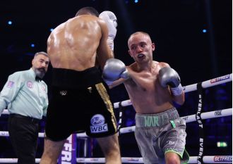 In the midst of a fight, a boxer reveals a surprising truth to their trainer.