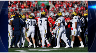 Michigan's shocking win over Ohio State leads to a chaotic fight between fans.