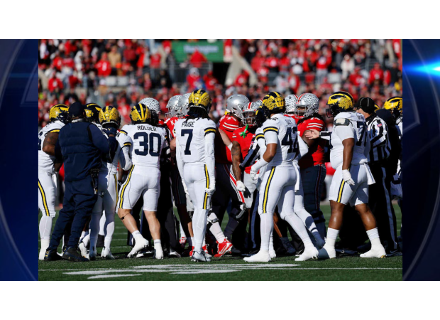 Michigan's shocking win over Ohio State leads to a chaotic fight between fans.
