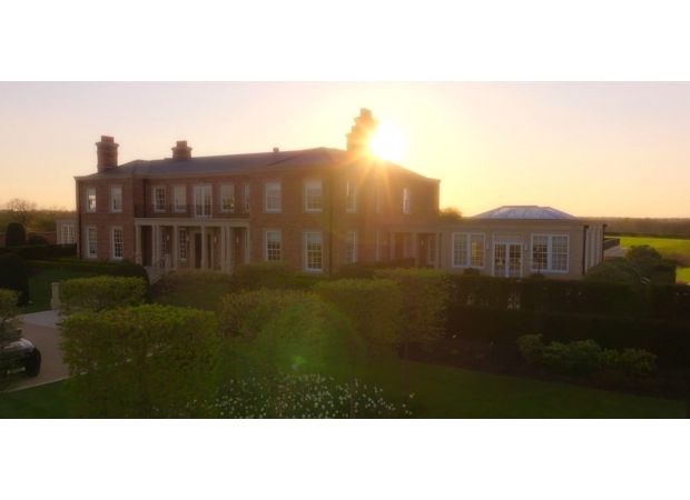 Take a look inside the lavish £20 million home of Coleen and Wayne Rooney, complete with a football pitch, bars, and even an underground tunnel.