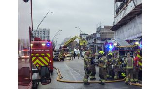A child was hospitalized after a fire broke out in a flat in east London.