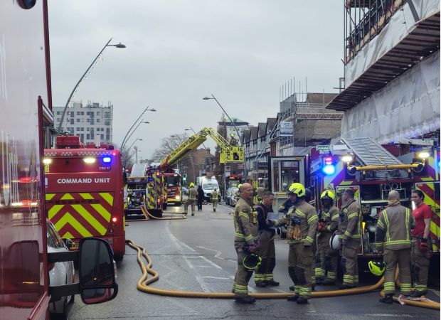 A child was hospitalized after a fire broke out in a flat in east London.