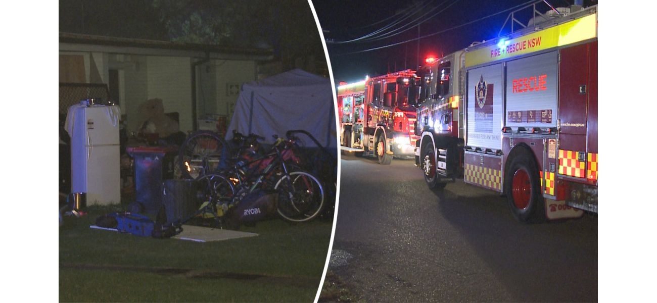 Firefighters are having difficulty putting out a fire at a hoarder's property in Sydney.