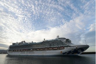 A tourist has gone missing after falling off a luxury cruise ship.