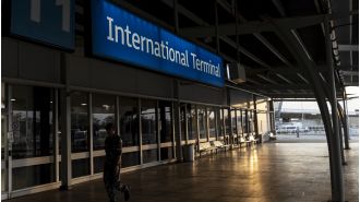 Man assaults security at Sydney Airport after forcing his way onto a plane.