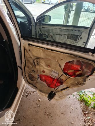 A Putin photo was used as a cover to hide $18 million worth of drugs concealed in car doors.