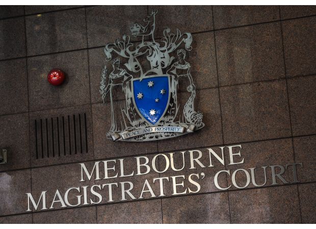 A person charged with murder in Melbourne's western region weeps during their appearance in court.