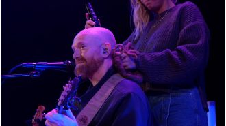 A famous singer from the 2000s shaved their head during a performance, creating a powerful and impactful moment.