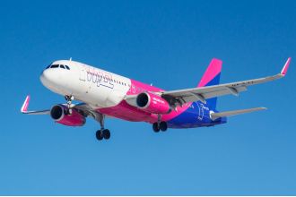 Wizz Air restarts 'unpopular' unlimited flying program, causing dissatisfaction among travelers.