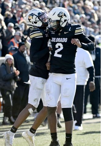 Colorado's Travis Hunter and Shedeur Sanders have been awarded the Big 12 player of the year titles.
