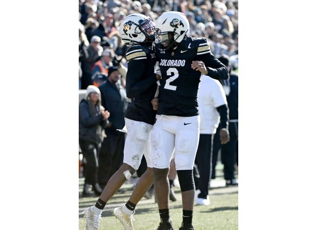 Colorado's Travis Hunter and Shedeur Sanders have been awarded the Big 12 player of the year titles.