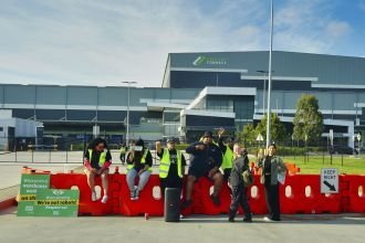 Woolworths making progress with restocking, but union remains resistant.