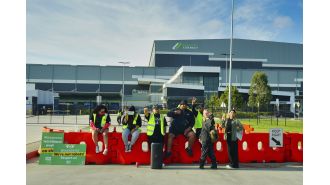 Woolworths making progress with restocking, but union remains resistant.