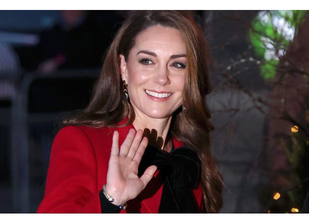Kate Middleton adds holiday flair to previous ensemble for special Christmas carol event.