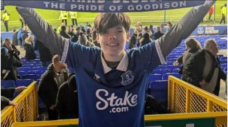 A young Everton fan from Australia used his savings to fly and watch the postponed Merseyside derby.