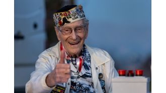 A 100-year-old survivor honors Pearl Harbor Remembrance Day through photos.
