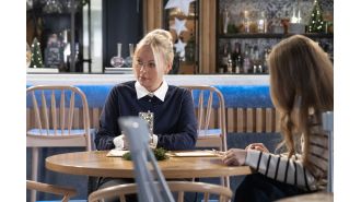 Lisa is feeling very jealous as she watches Carla flirt with a handsome customer on Coronation Street.