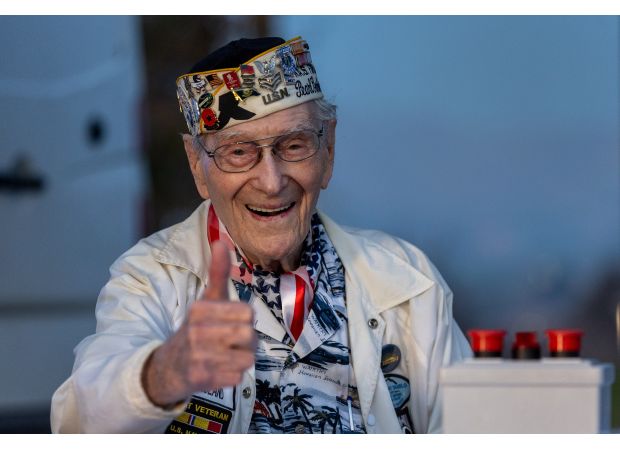 A 100-year-old survivor honors Pearl Harbor Remembrance Day through photos.