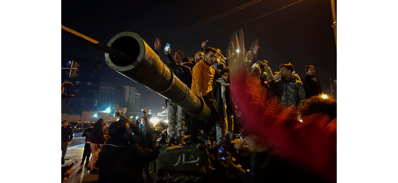 Syrians rejoice and shoot in the air to mark the downfall of the Assad family's 50-year reign.