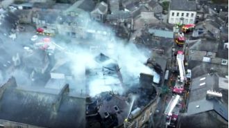 A man in his 40s died in a fire that destroyed an apartment building.