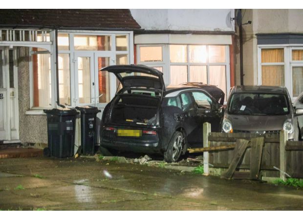 A woman in her 60s died when her car collided with a house.