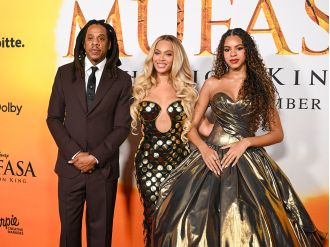 Jay-Z and Beyoncé proudly accompany their daughter, Blue Ivy Carter, to the premiere of The Lion King.