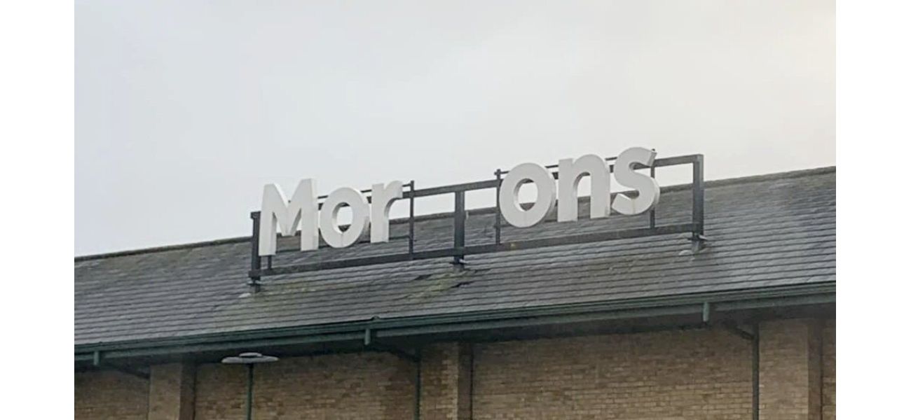 Morrisons is trying to fix their sign after a storm caused damage.