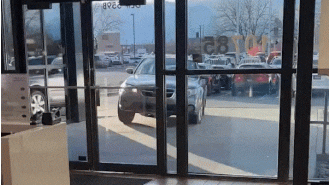 Angry driver crashes into US dealership after being denied return.