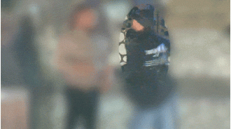 Video footage shows unidentified man wielding an axe and threatening a stranger at an ATM in Melbourne.