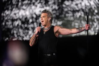 Robbie Williams upset over ticket scalper buying £1.5 million mansion with profits from his shows.
