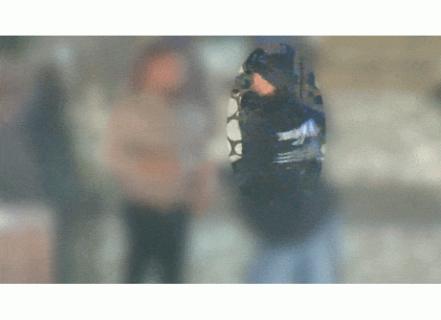 Video footage shows unidentified man wielding an axe and threatening a stranger at an ATM in Melbourne.