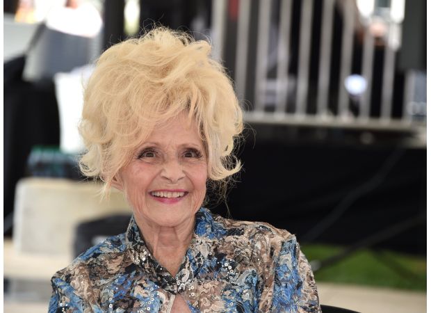 Famous singer, age 13 at the time, emotional while commemorating milestone of recording Christmas classic.