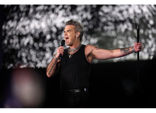 Robbie Williams upset over ticket scalper buying £1.5 million mansion with profits from his shows.