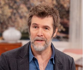 Comedian Rhod Gilbert still facing challenges 2 years post-cancer treatment.