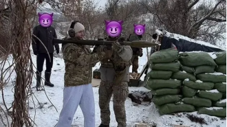 Ukrainian tennis player Elina Svitolina takes photo with large missile launcher during Russian invasion.