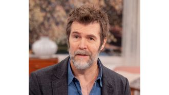 Comedian Rhod Gilbert still facing challenges 2 years post-cancer treatment.