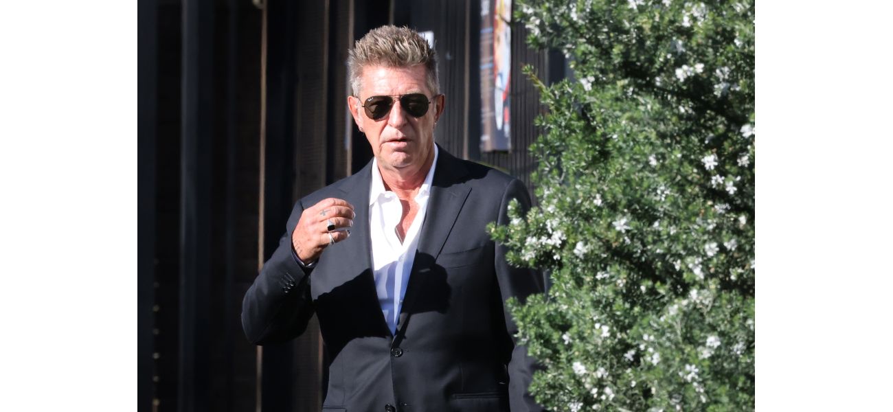 Fashion designer Wayne Cooper denies assault claim by wife at Bondi hotel.
