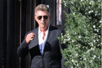 Fashion designer Wayne Cooper denies assault claim by wife at Bondi hotel.