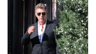 Fashion designer Wayne Cooper denies assault claim by wife at Bondi hotel.