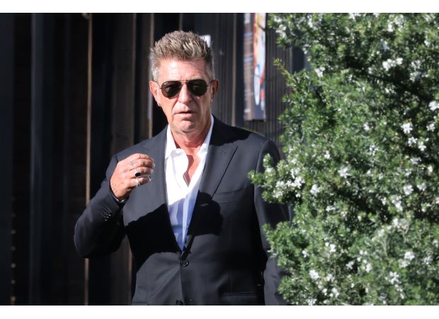 Fashion designer Wayne Cooper denies assault claim by wife at Bondi hotel.