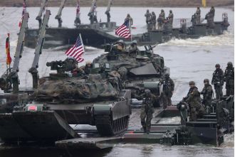 NATO urges change to 'wartime mentality' in response to Russian threats.