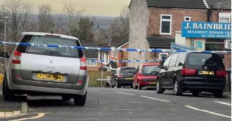 A primary school is on lockdown as a man in his 40s was stabbed and the attacker is still at large.
